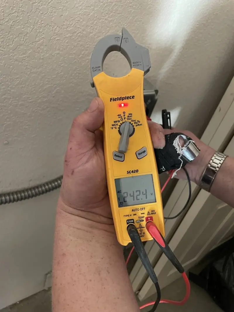 Voltage testing with clamp meter during Ceiling Fan Installation in Troy